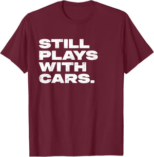 Still Plays With Cars Funny Garage Mechanic T-Shirt - T-Shirt | Maroon
