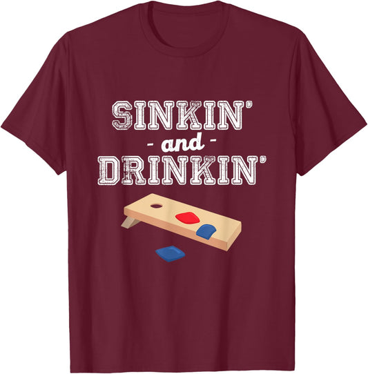 Sinkin' and Drinkin' - Cornhole Playing Funny Gift T-Shirt - T-Shirt | Maroon