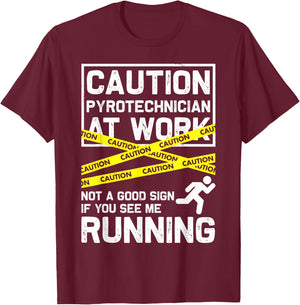 Caution Pyrotechnician At Work... Fireworks Pyro Funny Gift T-Shirt - T-Shirt | Maroon