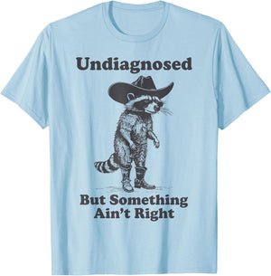 Undiagnosed But Something Ain't Right Raccoon Funny Saying T-Shirt - T-Shirt | Light Blue