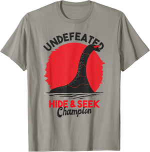 Loch Ness Undefeated Hide & Seek Nessie Gift T-Shirt - T-Shirt | Sand
