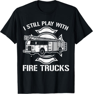 I Still Play With Fire Trucks Firefighter Day Fireman Gift T-Shirt - T-Shirt | Black